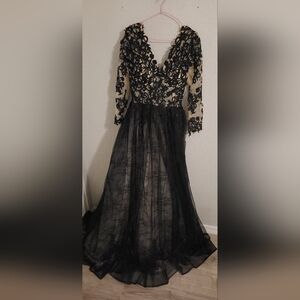 Size 12 black Gothic wedding dress. Never worn tag still on .